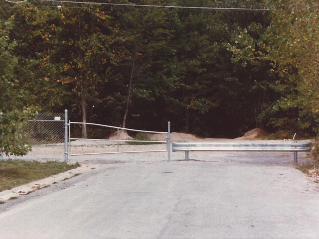 Commercial Barricade Gate With Steel Guard Rail Fence by Elyria Fence